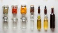 Several glass jars and bottles are arranged on a light surface Royalty Free Stock Photo