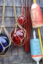 Several glass ornaments and buoys on seaside homes with clapboard siding, Rockport, Mass, 2019