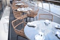 Several glass tables with wooden chairs ready prepared for lunch