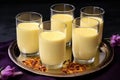 several glasses of badam milk with saffron strands Royalty Free Stock Photo