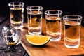 Several glasses of Mezcal or mescal is an exotic alcoholic drink from Mexico, distilled, variation of tequila, consumed with