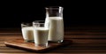 Several glasses with milk on a dark background