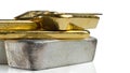 Several gold and silver bars of different weight isolated on a white Royalty Free Stock Photo
