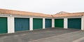 Several green doors car garage outdoors Royalty Free Stock Photo
