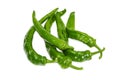 Several green peppers chili on a light background