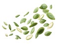several green pumpkin seeds levitating against a white background, creating a dynamic and visually appealing image, perfect for Royalty Free Stock Photo