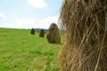 Several hayrick on the green field Royalty Free Stock Photo