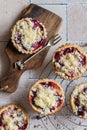 Several home baked plum crumble tarts from above