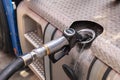 Fuel gun in the tank of a truck Royalty Free Stock Photo