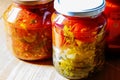 Several jars of tinned vegetables on a wooden table Royalty Free Stock Photo