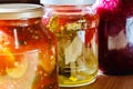 Several jars of tinned vegetables on a wooden table Royalty Free Stock Photo