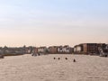 several kayaks rowing down river stream into harbour in wivenhoe Royalty Free Stock Photo