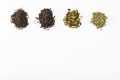 Several kinds of tea leaves black green collection different white background