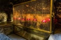 Several lamps are closed behind bars in the Christmas Cave in the Church of Nativity in Bethlehem in Palestine Royalty Free Stock Photo