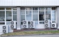 Several large air conditioning units, group of air conditioning compressors out of office building Royalty Free Stock Photo