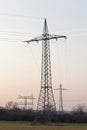 Several large electricity pylons in different types
