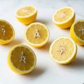 Several lemon halves are displayed on a white surface. The lemons are bright yellow with visible Royalty Free Stock Photo
