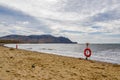 Several lifebuoys on a sandy sea beach