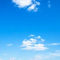 Several light cumuli clouds in blue sky