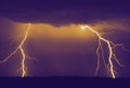 Several lightning strikes during a strong thunderstorm over the lake Royalty Free Stock Photo