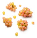 Several little clusters of raisins grapes isolated on white. Bright saturated color of red and yellow.