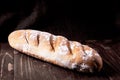 Several loaves of bread wheat, baguette in a wicker basket on a black background Royalty Free Stock Photo