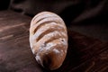 Several loaves of bread wheat, baguette in a wicker basket on a black background Royalty Free Stock Photo