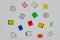 several lonely transparent colored plastic resin granulates for background