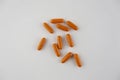 Several long orange colored tablets.