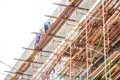 Several male workers on the construction of a high-rise building around the Simpang Lima Boyolali City are working without using Royalty Free Stock Photo
