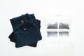 Several man trousers and a filter from dryer machine full of lint, dust and wool. Flat lay, top view Royalty Free Stock Photo