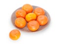 Several mandarins on brown plate