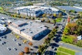 Several many cars are parked in a large parking lot near shopping mall center in New Jersey, USA.