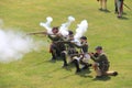 Several men dressed in soldier`s uniforms, using rifles during war reenactments, Fort Ontario, Oswego, NY, 2016