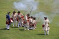 Several men dressed in soldier`s uniforms, using rifles during war reenactments, Fort Ontario, Oswego, NY, 2016