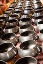 Several Monk`s Bowls or Almsbowls in Buddhist temple for donate money from Buddhism prayers. Thai