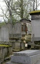 Several moss covered tombs and headstones, Pere Lachaise,Paris,France,2016