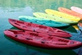 Several multi-colored plastic boats await tourists for walking