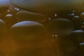 Several oil droplets on water