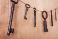 Several old rusty keys on a burlap background. Retro and vintage, steampunk.