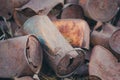 Several old rusty recycling cans