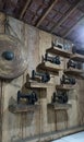 Several old sewing machines and Javanese gongs are used as room decorations on wooden walls