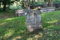 Numerous old weathered headstones and lengths of stonewalls, Walloon Cemetery, historic Huguenot Street, New York, 2018 Royalty Free Stock Photo