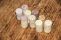 Several old wine corks stand on wooden background side Royalty Free Stock Photo
