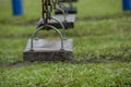 Several old wooden swings in the background have blurred grass Royalty Free Stock Photo