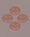 several orange scary heads, four of them, on a beige background. halloween, holiday and fun concept