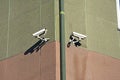 Several outdoor surveillance camera mounted on the wall of the house