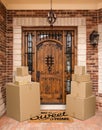 Several Packages Sitting on Home Sweet Home Welcome Mat At Front Door of House