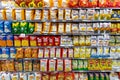 Several packs of chips and snack. Shelves with different brands of potato chips.