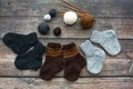 Several pairs of woolen newborns socks, on dark background